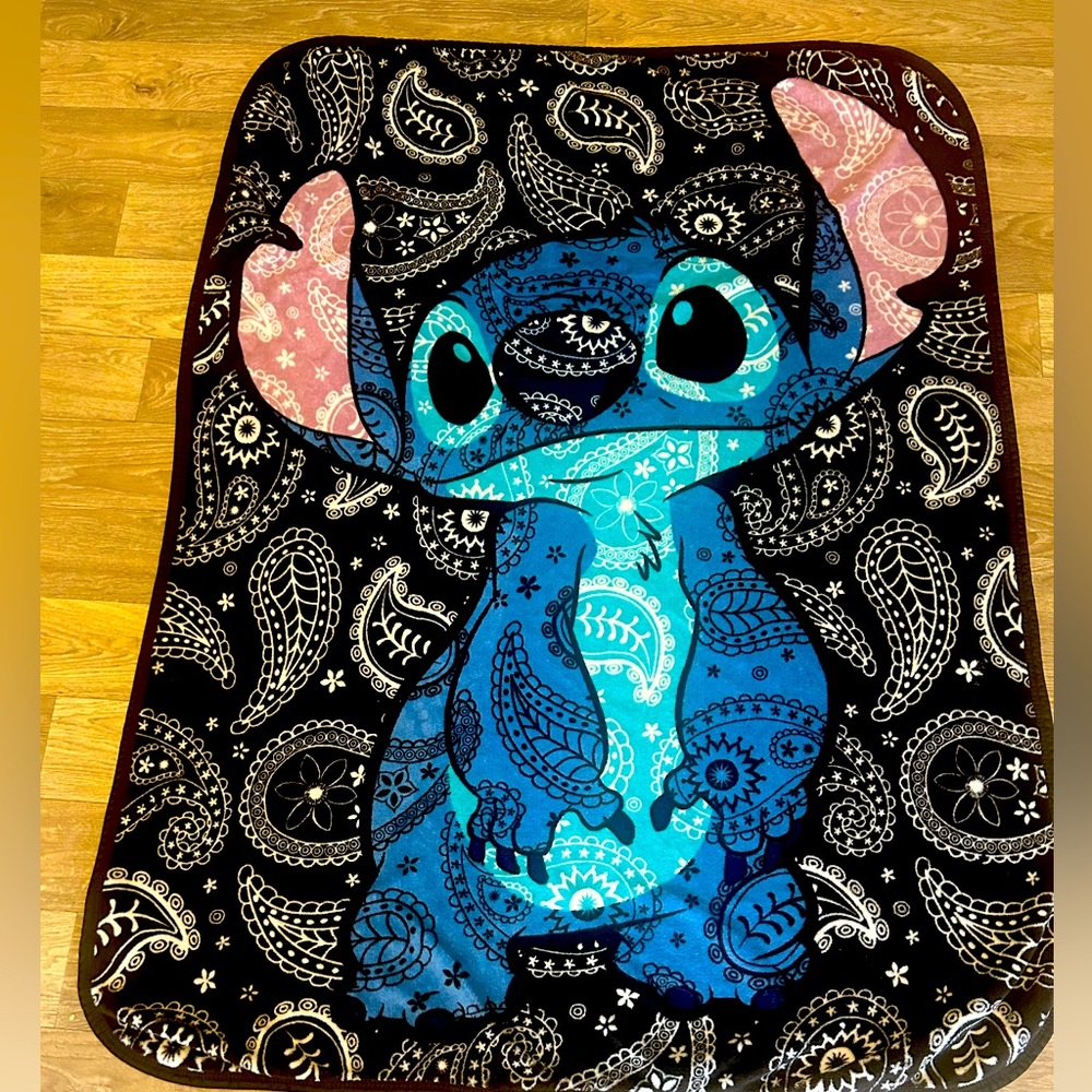 A Disney stitch blanket. Perfect for a movie night. Front and back pictures.